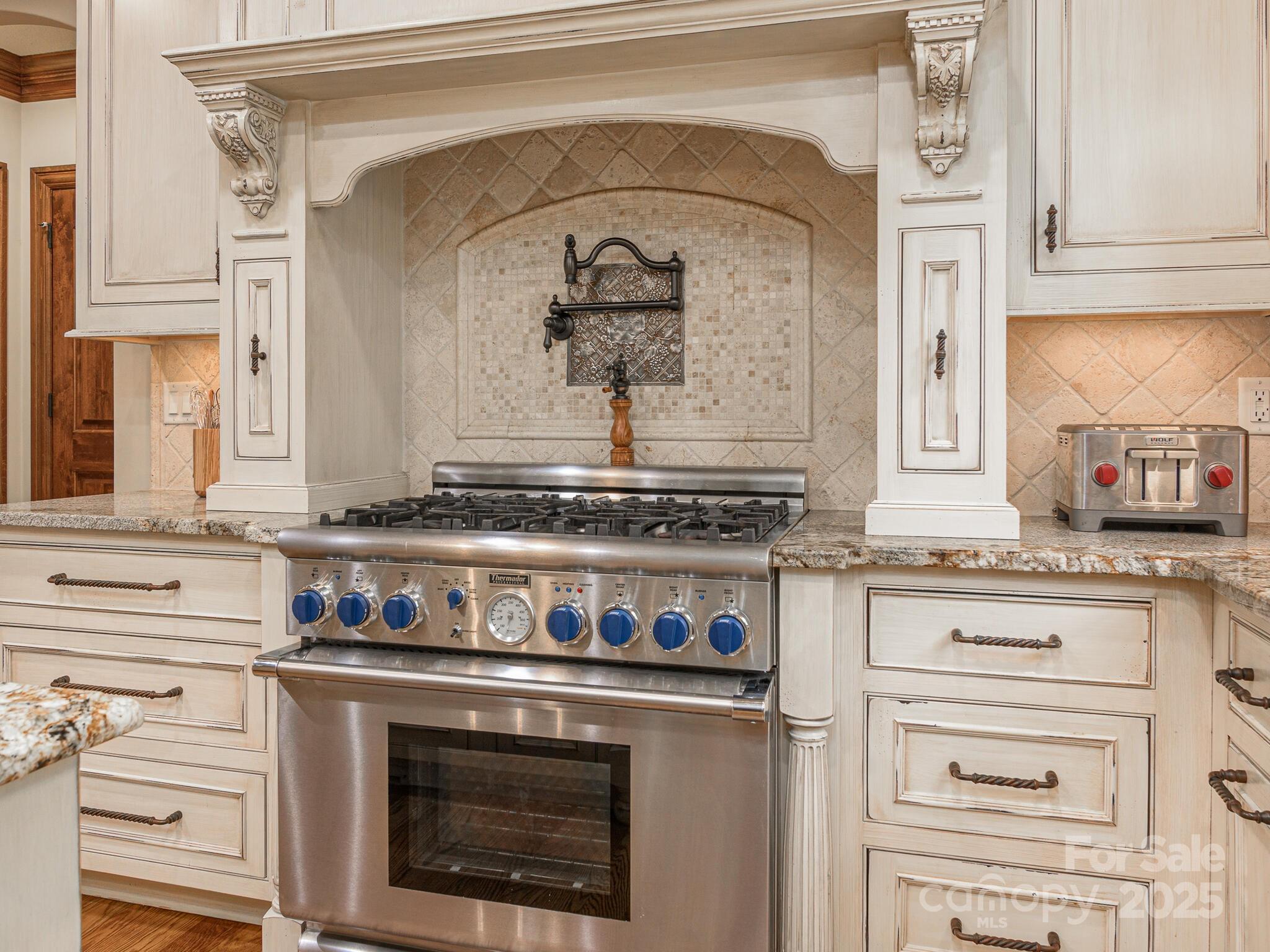 176 Valley Springs Road Asheville, NC 28803 - Photo 41 of 48 a kitchen with granite countertop a stove and a sink