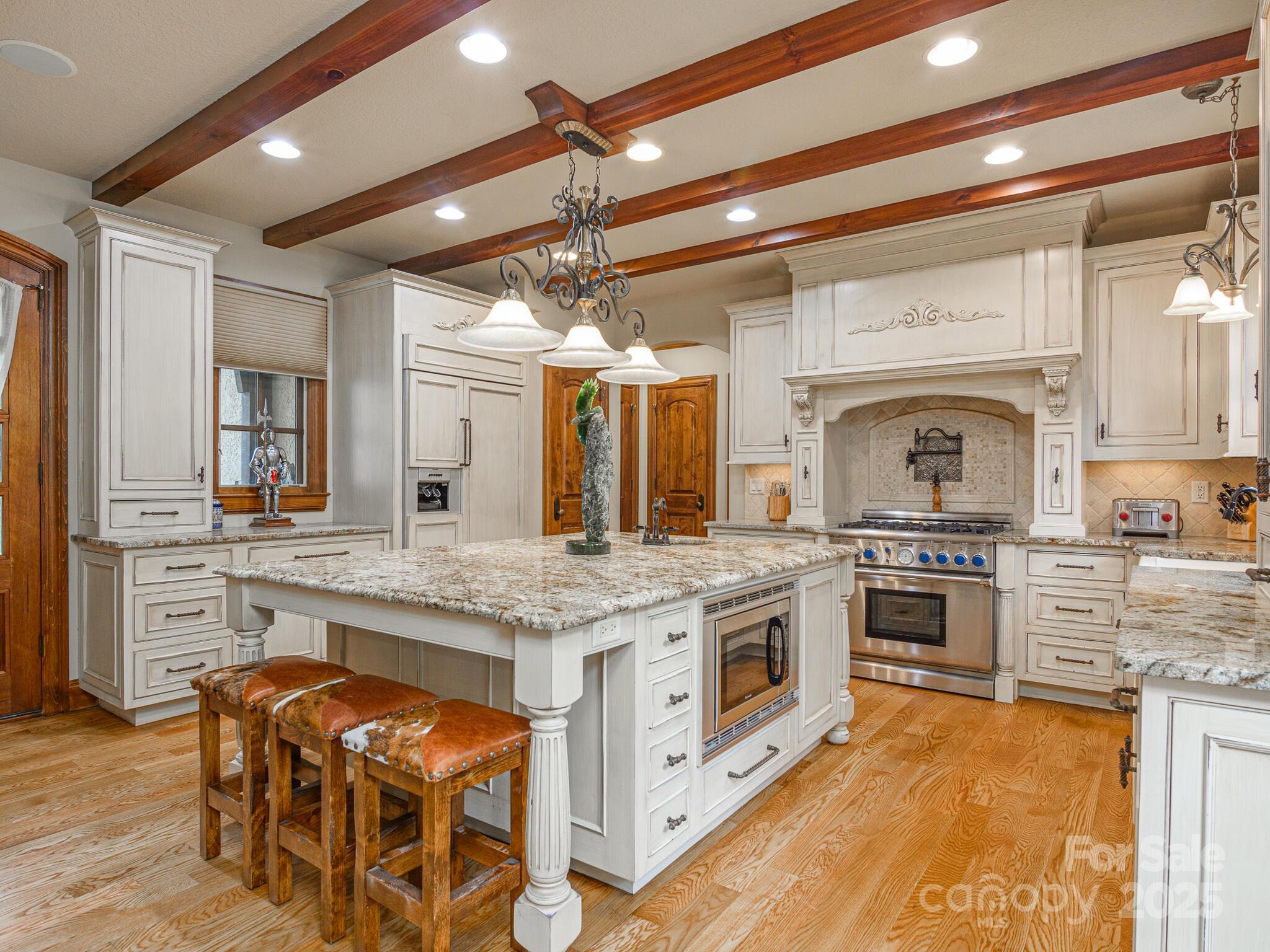 176 Valley Springs Road Asheville, NC 28803 - Photo 8 of 48 a kitchen with stainless steel appliances granite countertop a stove and cabinets