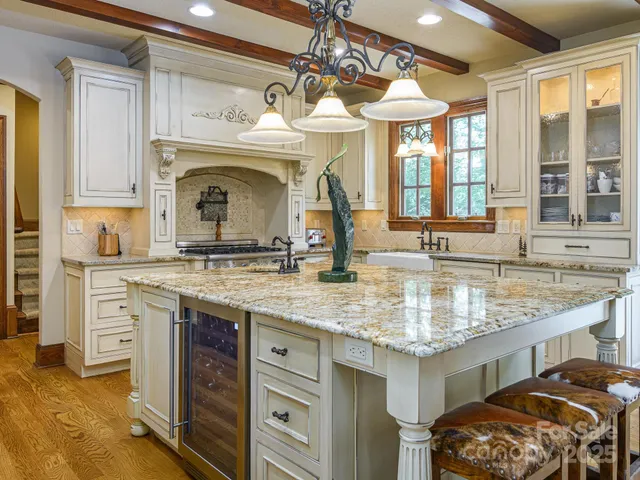 a living room with a bed furniture and a large window
