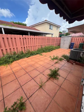 a view of backyard with cabin