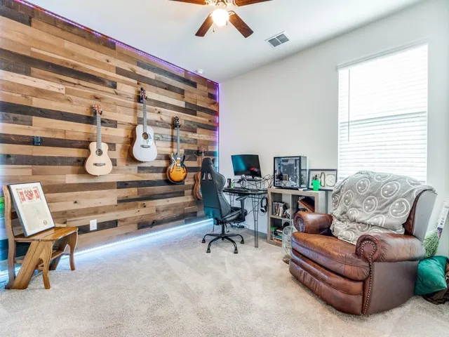 a living room with furniture a air conditioner and a window