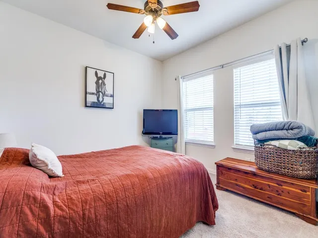 a bedroom with a bed and window