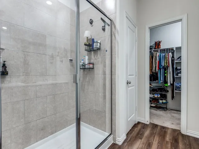 a view of a bathroom from a hallway