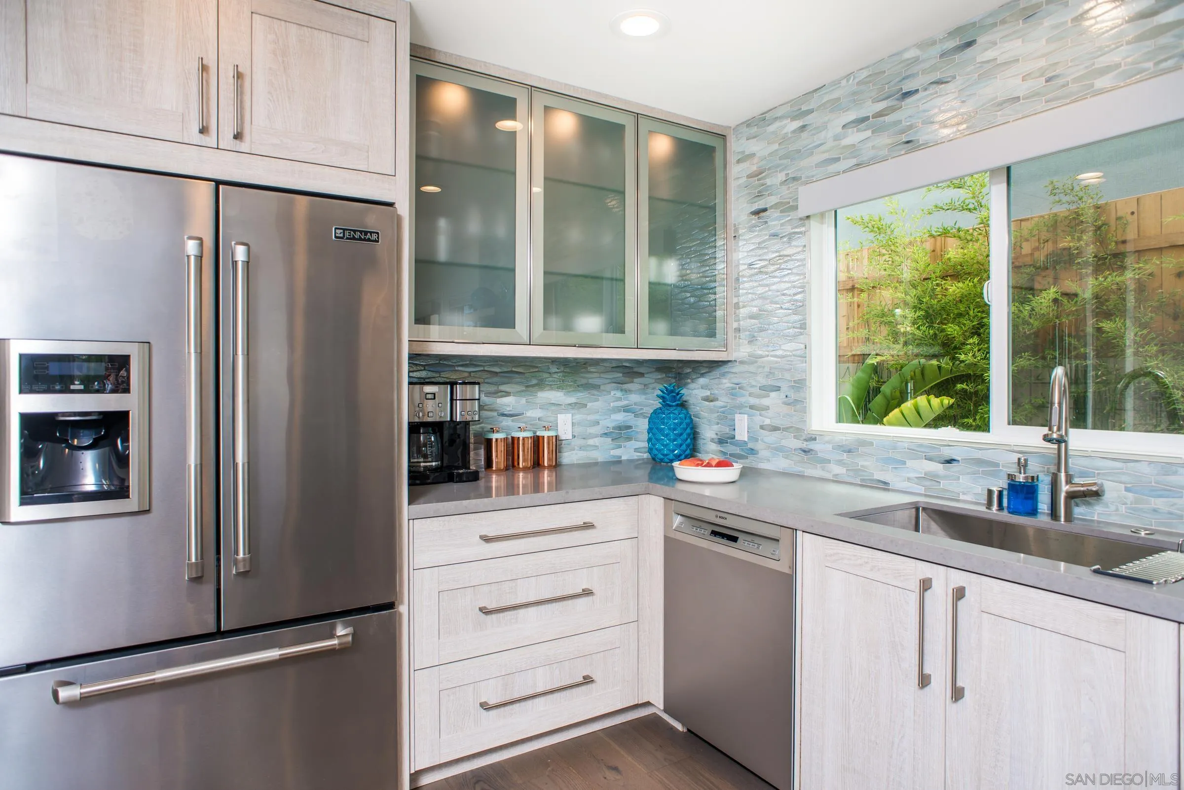129 West Jason Street Encinitas, CA 92024 - Photo 12 of 44 a kitchen with stainless steel appliances granite countertop a refrigerator and a sink