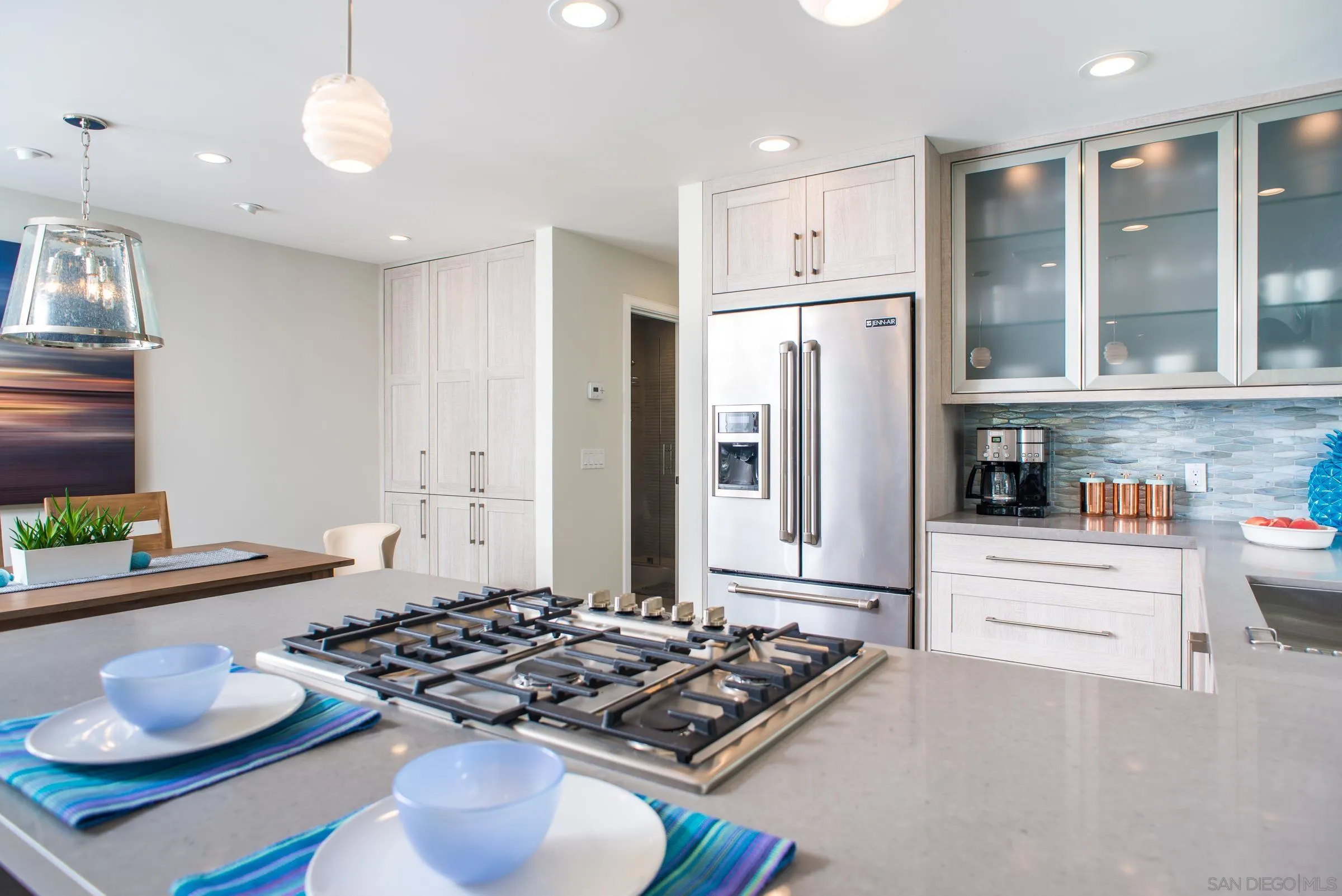 129 West Jason Street Encinitas, CA 92024 - Photo 16 of 44 a kitchen with stainless steel appliances granite countertop a stove and a refrigerator