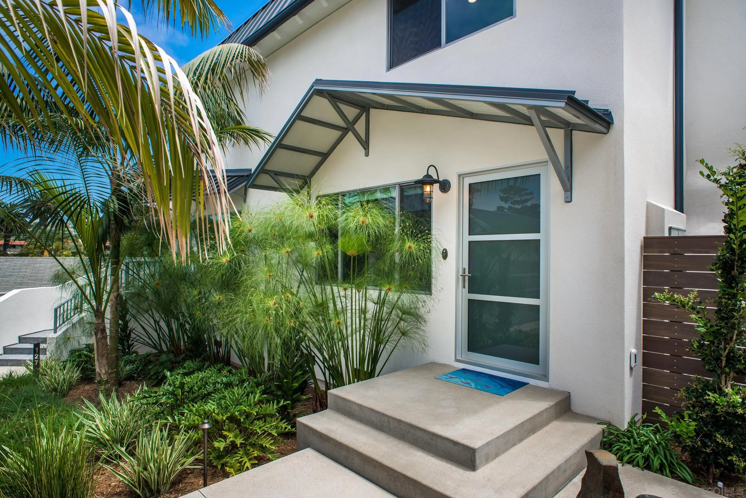 129 West Jason Street Encinitas, CA 92024 - Photo 3 of 44 a view of front door and potted plants