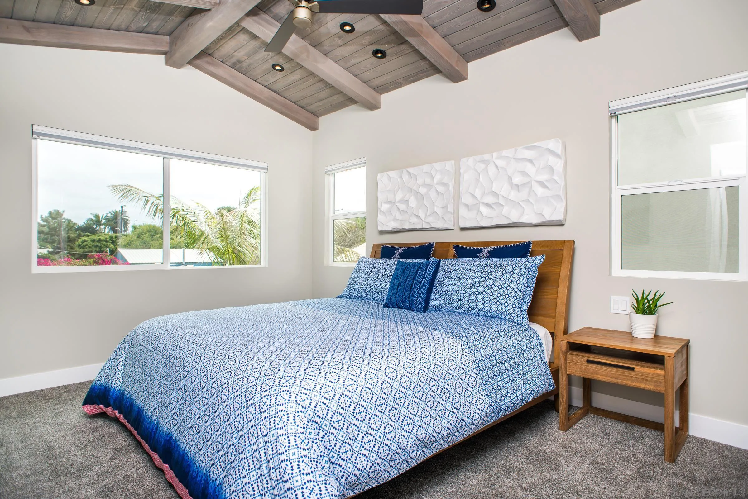 129 West Jason Street Encinitas, CA 92024 - Photo 32 of 44 a large bed sitting in a bedroom next to a window