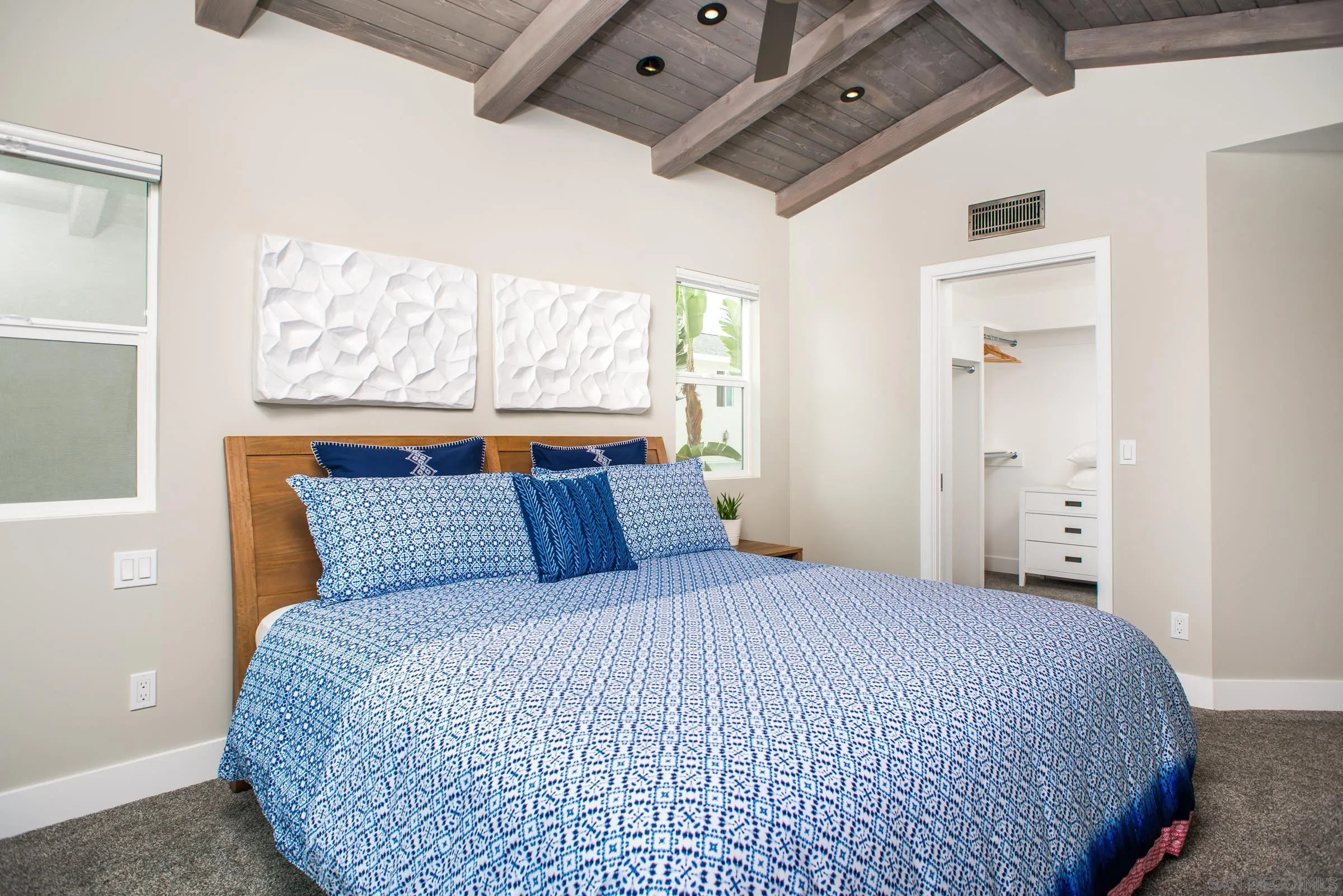 129 West Jason Street Encinitas, CA 92024 - Photo 35 of 44 a bedroom with a bed and a window