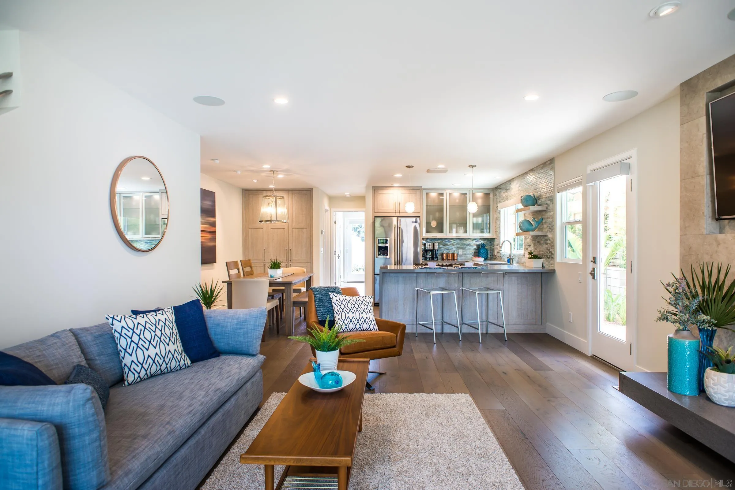 129 West Jason Street Encinitas, CA 92024 - Photo 6 of 44 a living room with furniture and a dining table with wooden floor
