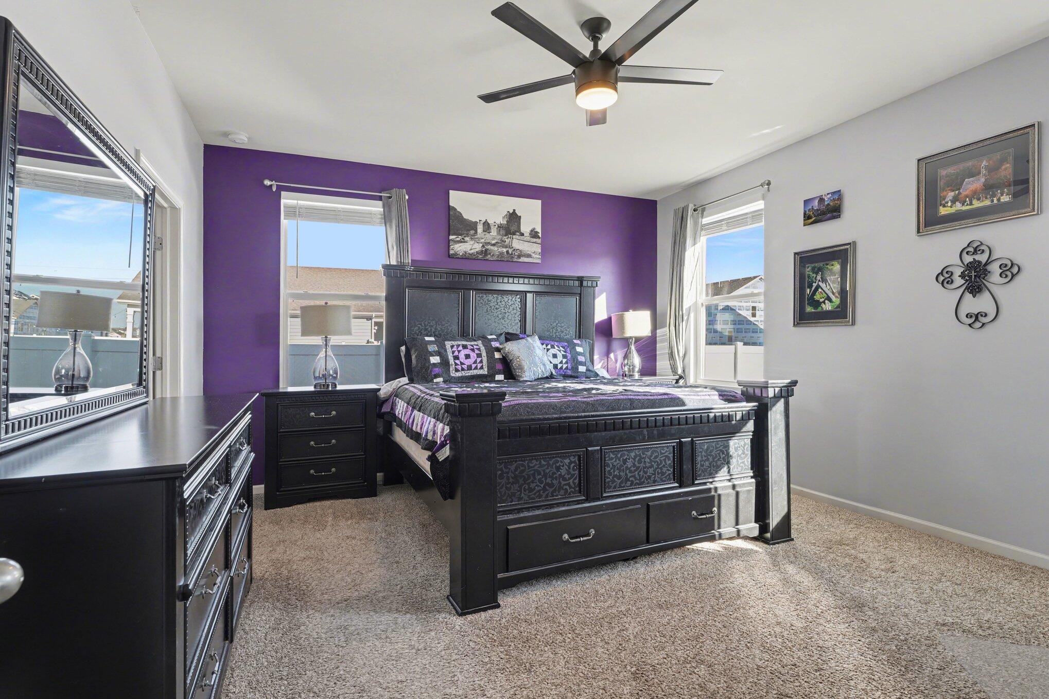 7787 West 105th Place Crown Point, IN 46307 - Photo 14 of 32 a bed room with a bed and a ceiling fan