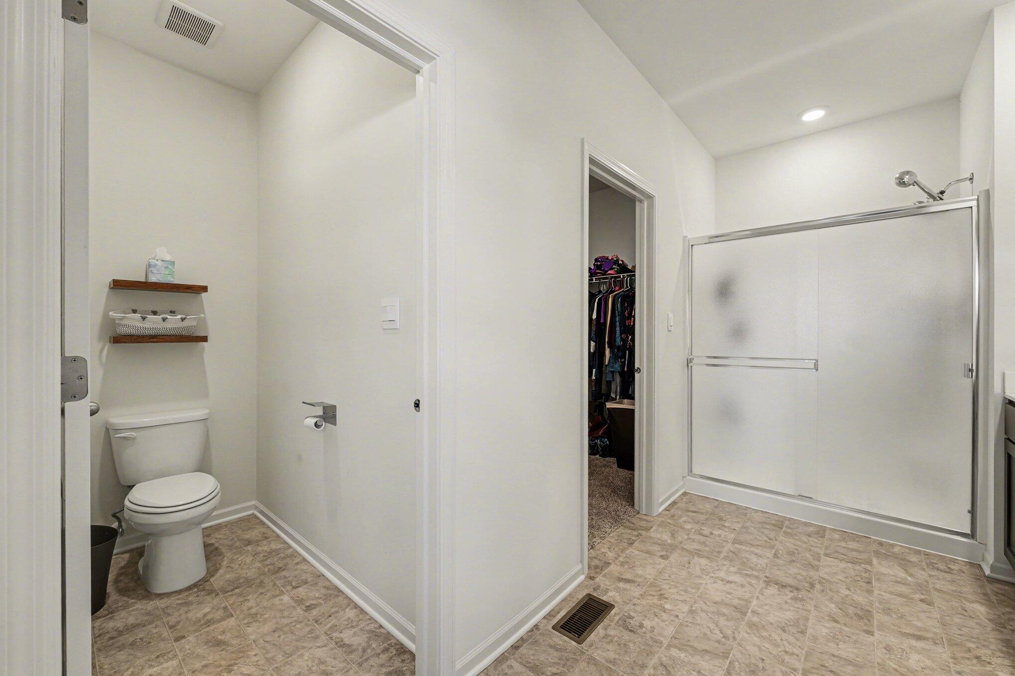 7787 West 105th Place Crown Point, IN 46307 - Photo 16 of 32 a bathroom with a granite countertop toilet and a sink
