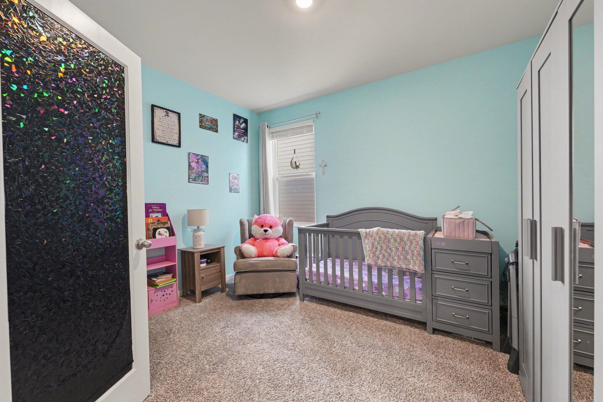 7787 West 105th Place Crown Point, IN 46307 - Photo 19 of 32 a bedroom with a bed and a window