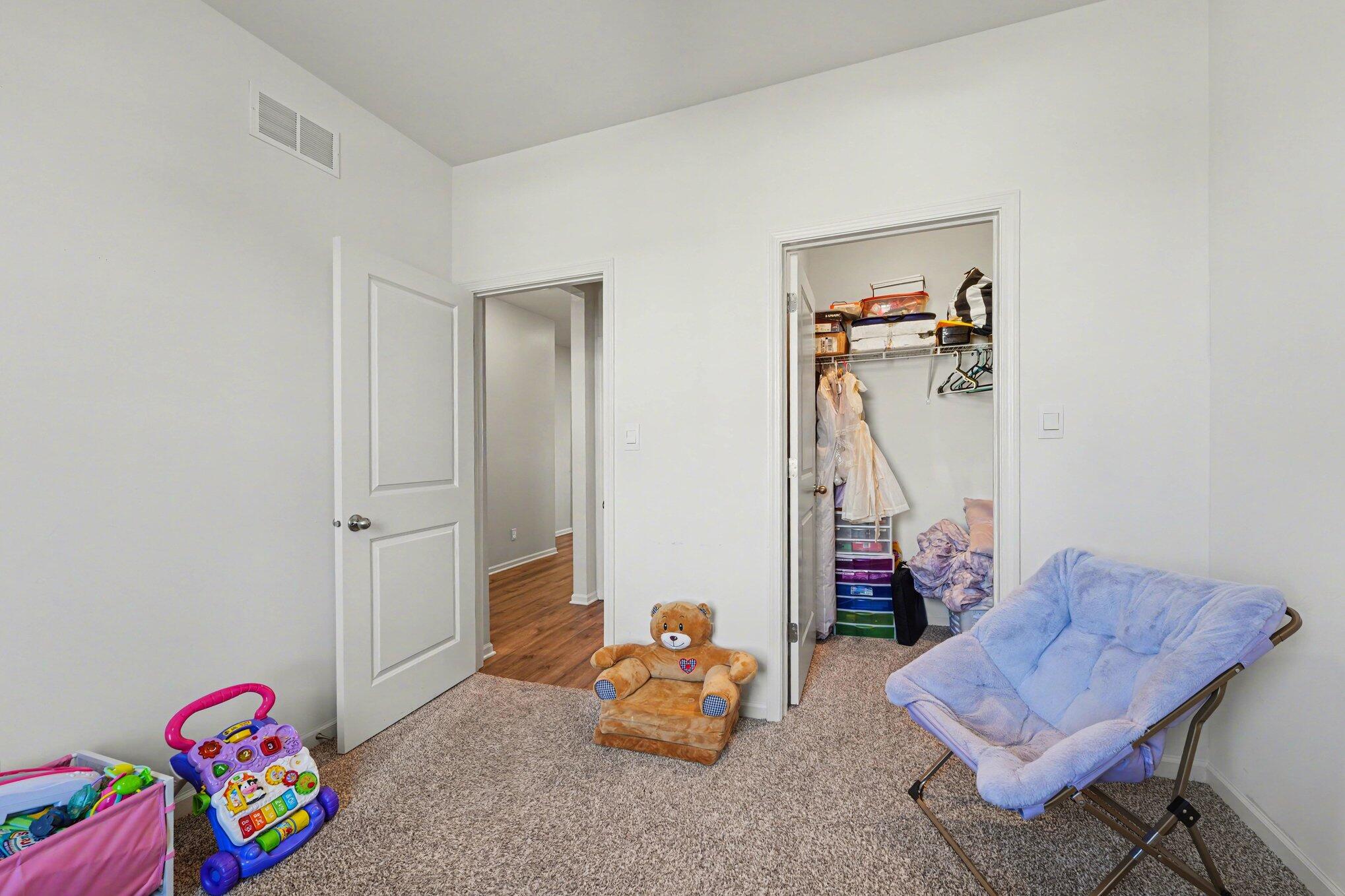 7787 West 105th Place Crown Point, IN 46307 - Photo 22 of 32 a room with toys and wooden floor
