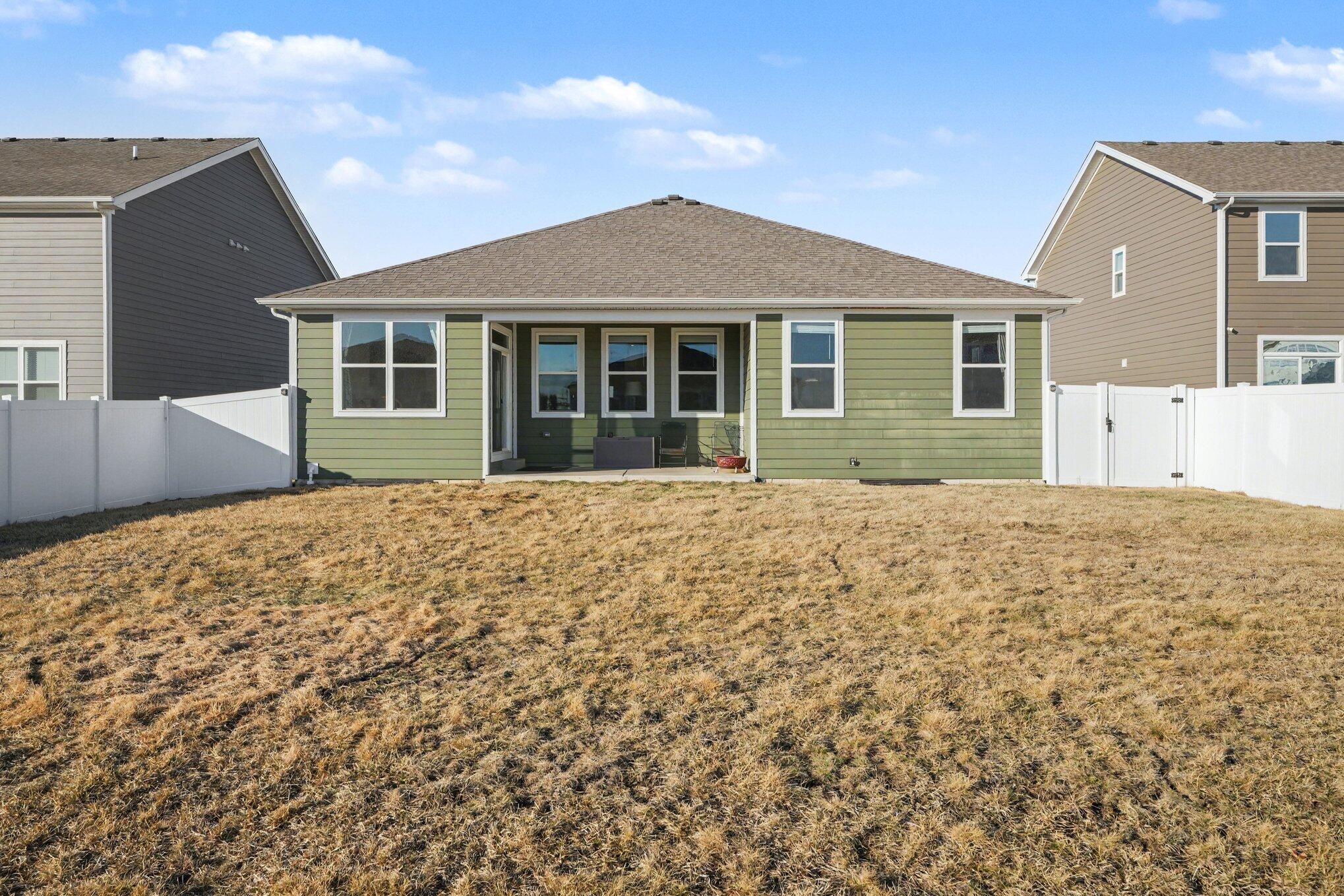 7787 West 105th Place Crown Point, IN 46307 - Photo 29 of 32 a front view of a house with a garden
