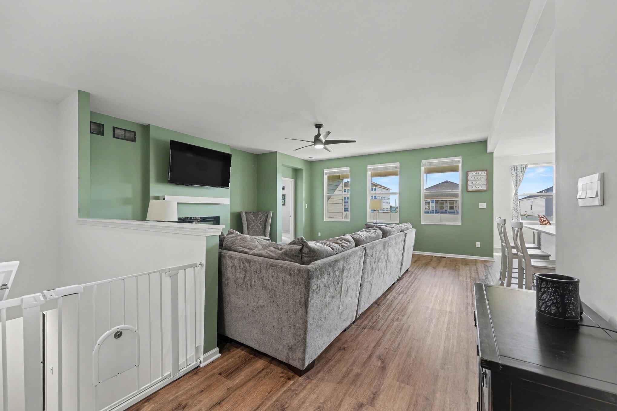 7787 West 105th Place Crown Point, IN 46307 - Photo 6 of 32 a living room with furniture and a flat screen tv