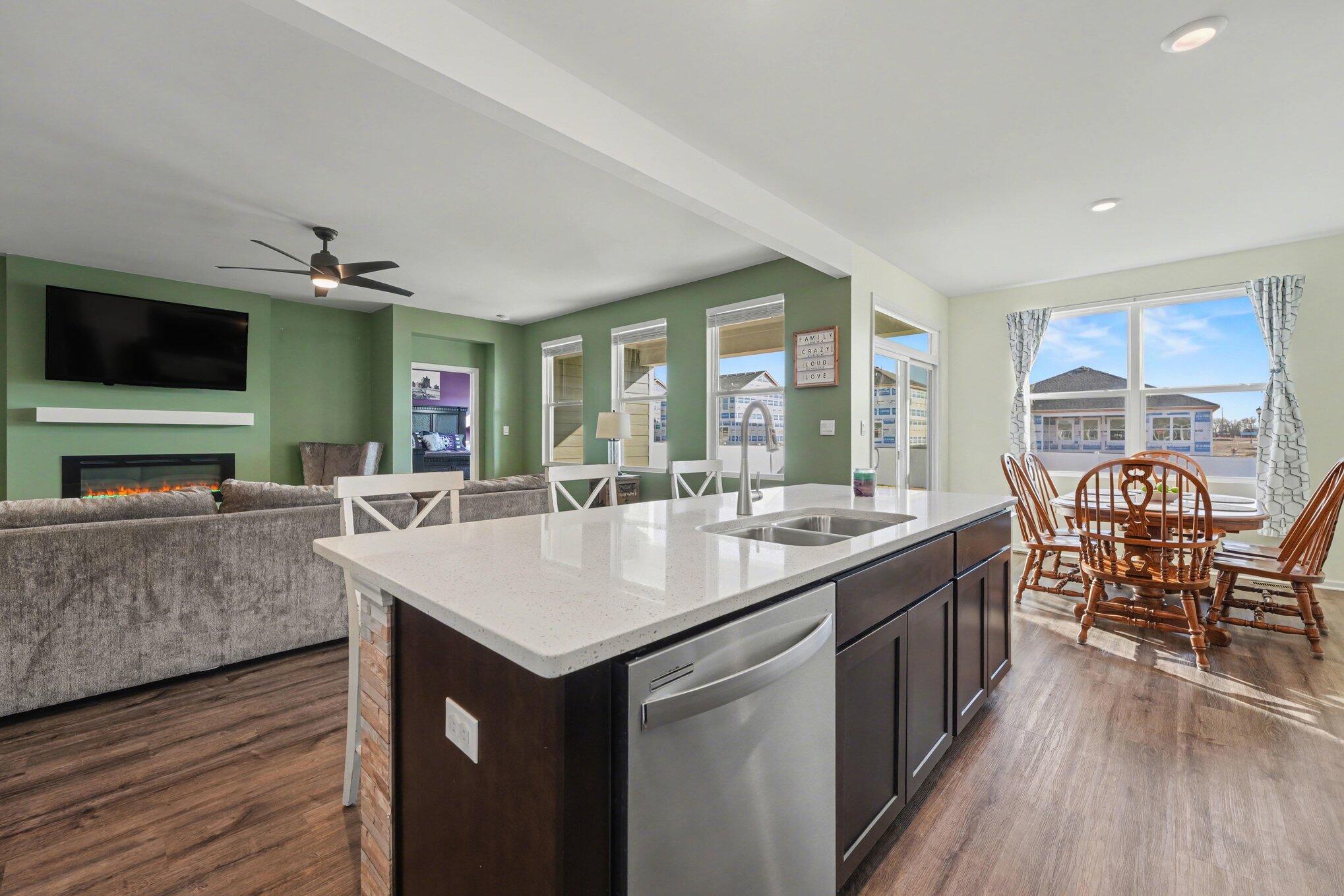 7787 West 105th Place Crown Point, IN 46307 - Photo 10 of 32 a living room with furniture a flat screen tv and a large window
