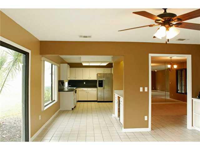 1992 Southeast Erwin Road Port St. Lucie, FL 34952 - Photo 3 of 17 a view of a living room with a flat screen tv