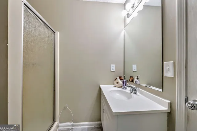 a bathroom with a sink and a mirror