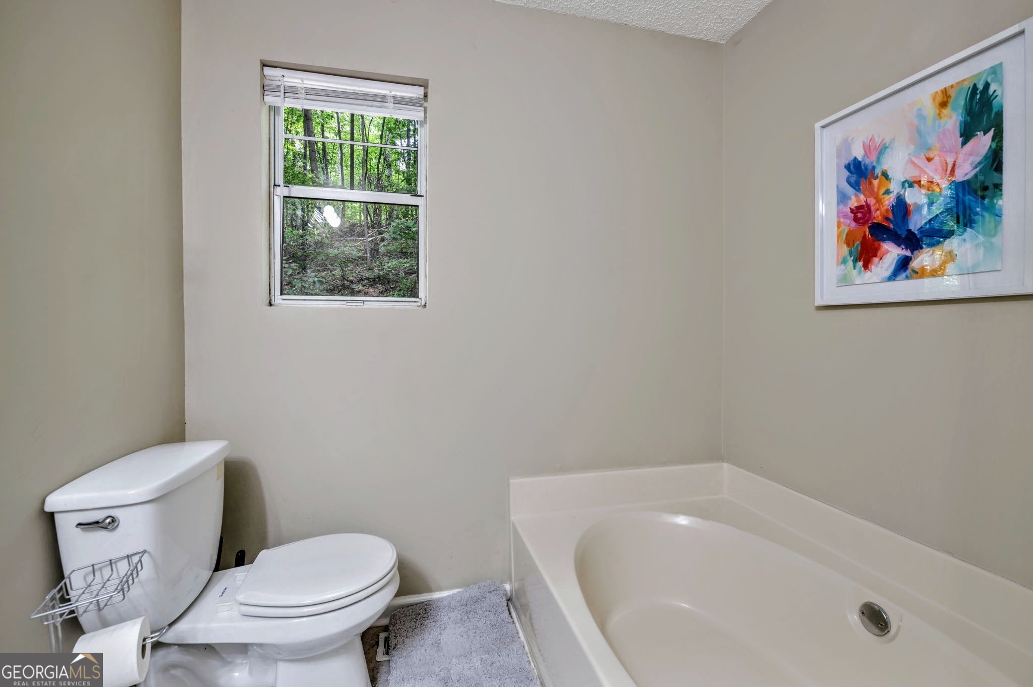 221 Remington Lane Acworth, GA 30101 - Photo 12 of 21 a white toilet sitting next to a bath tub