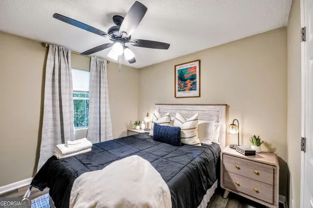 a bedroom with bed and a window