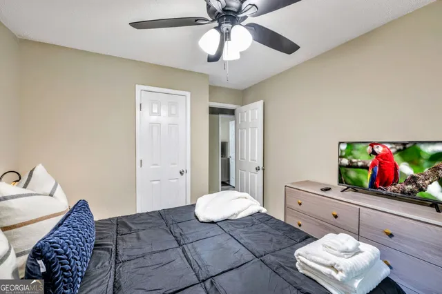 a living room with furniture and flat screen tv