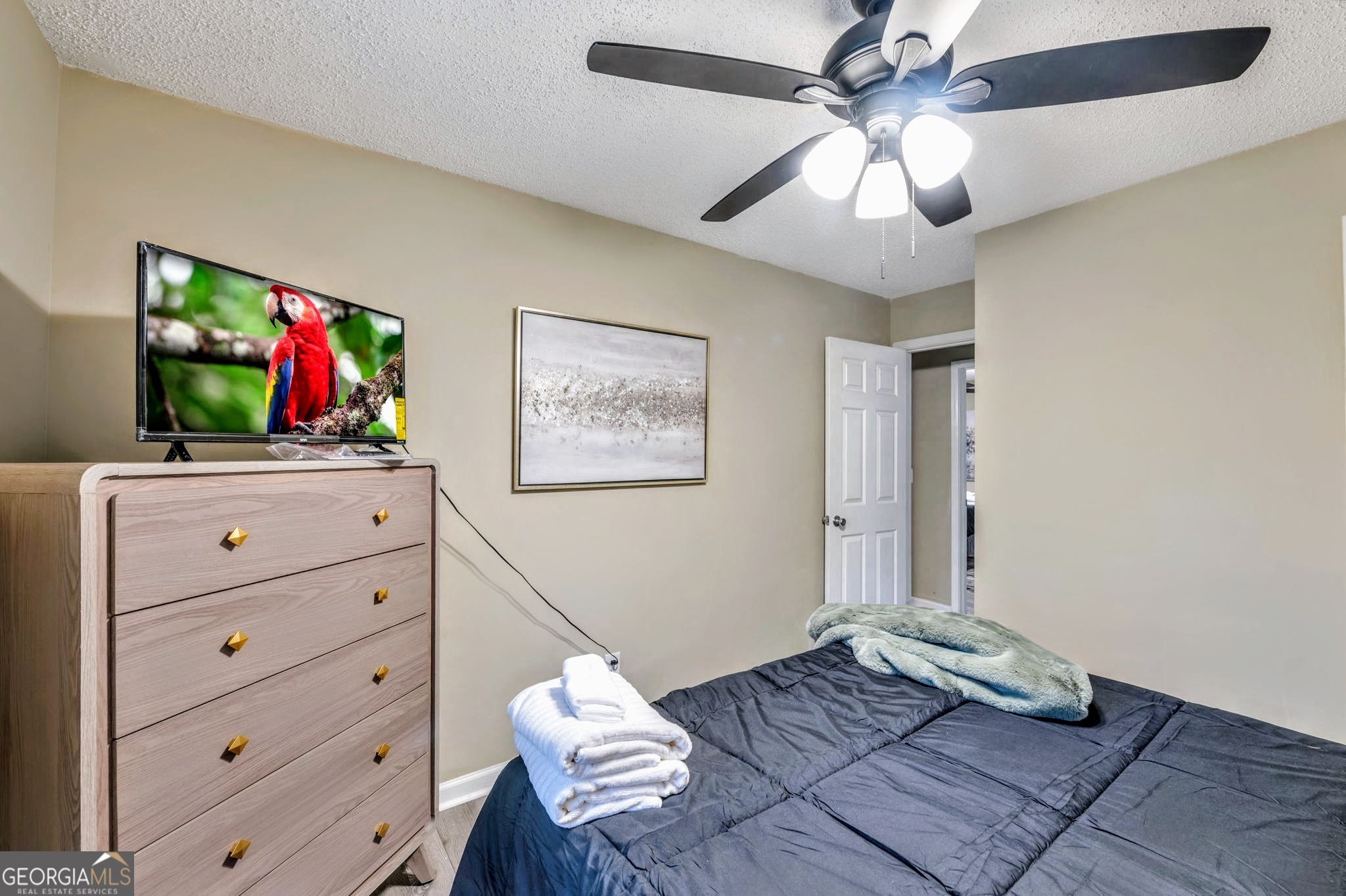 221 Remington Lane Acworth, GA 30101 - Photo 16 of 21 a living room with furniture and a flat screen tv