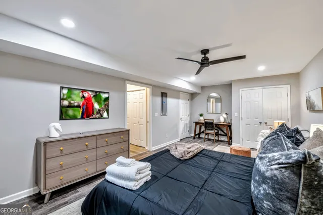 a living room with furniture and a flat screen tv