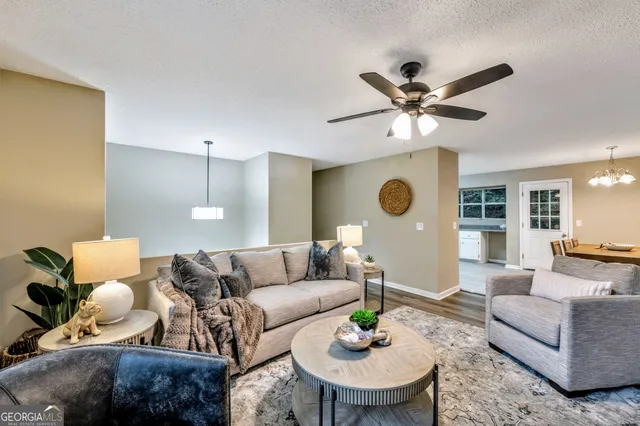 a living room with furniture and a table