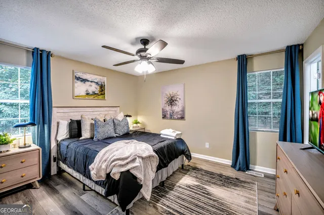 a bedroom with a large bed and a window