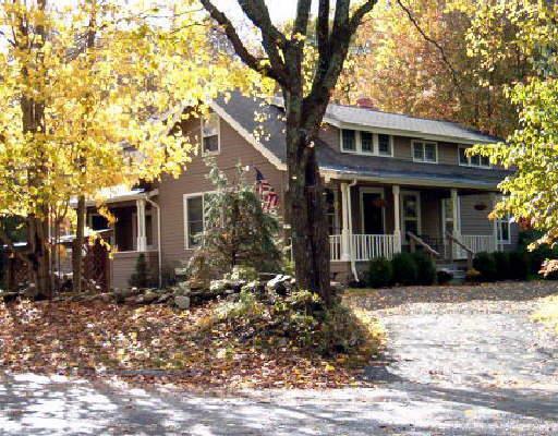 200 Pimpewaug Road Wilton, CT 06897 - Photo 1 of 1 a front view of a house with a yard