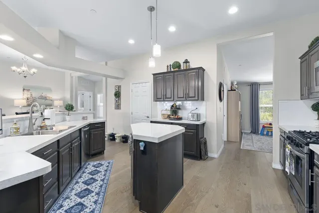 a bedroom with a bed couch and a window