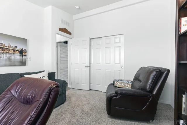 a bedroom with bed and wooden floor