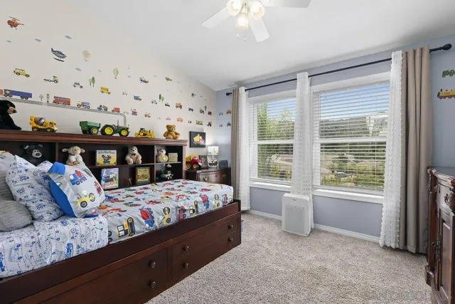 a bedroom with a workspace