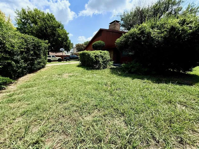 a backyard of a house with lots of green space