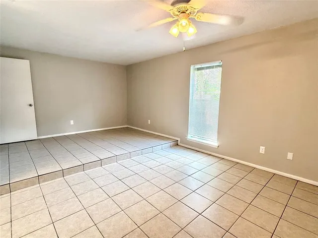 a view of an empty room and window