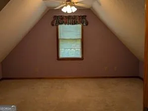 a view of empty room with a fireplace