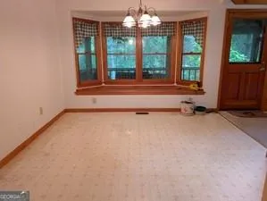a kitchen with refrigerator cabinets and a sink