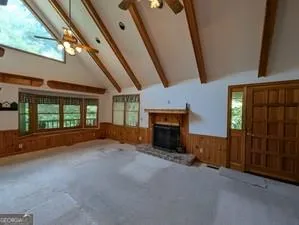 a view of a kitchen with a sink and a refrigerator
