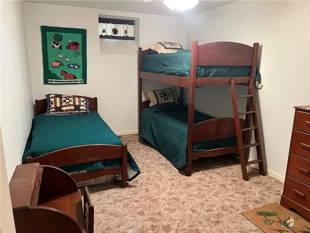 a room with furniture pool table and window