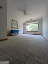 a view of entryway and hall with a front door