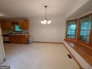 a view of an empty room with a fireplace