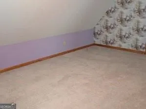 wooden floor and window in an empty room