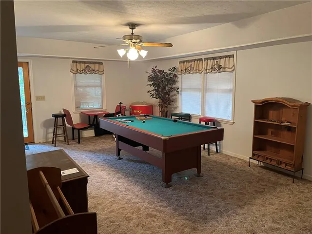 a bedroom with a bed and a chair