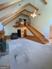 an empty room with windows and entrance