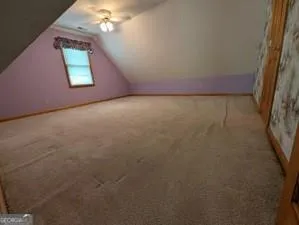 a view of a hallway with staircase