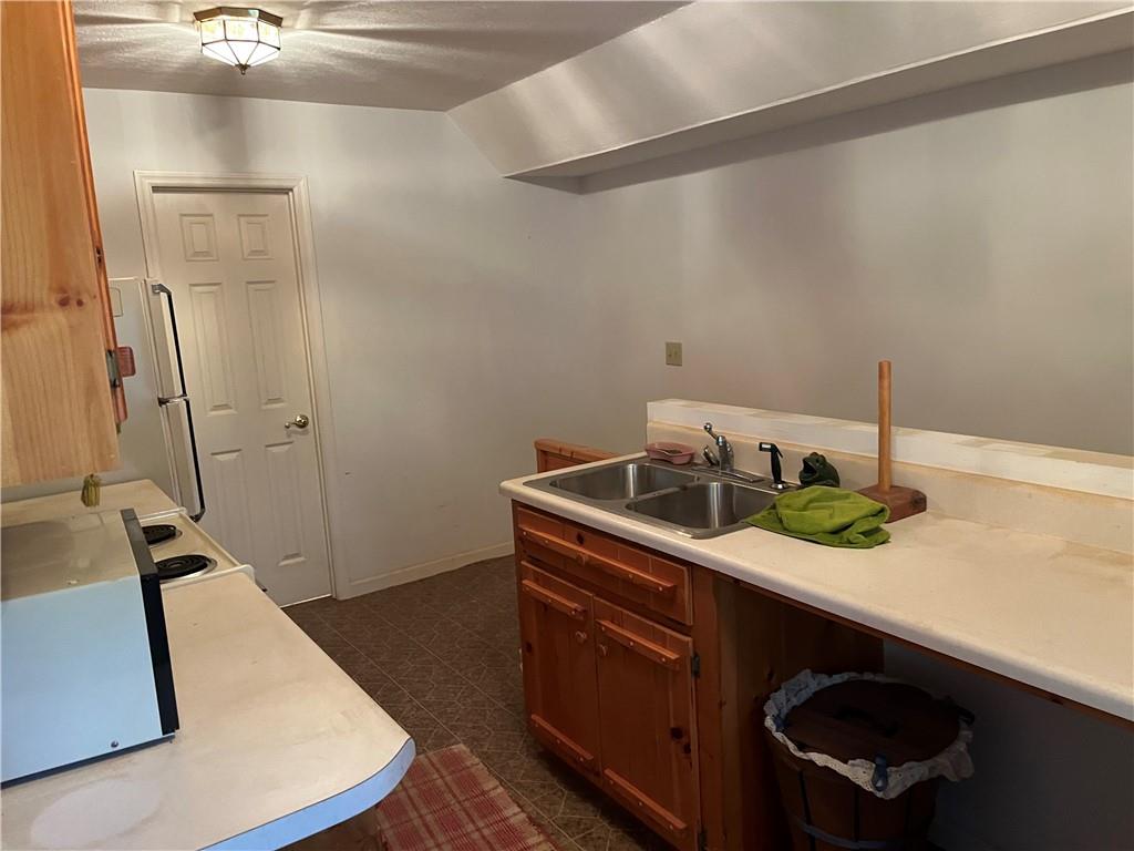 763 Sharp Top Circle Blairsville, GA 30512 - Photo 6 of 57 a kitchen with a sink a stove and cabinets