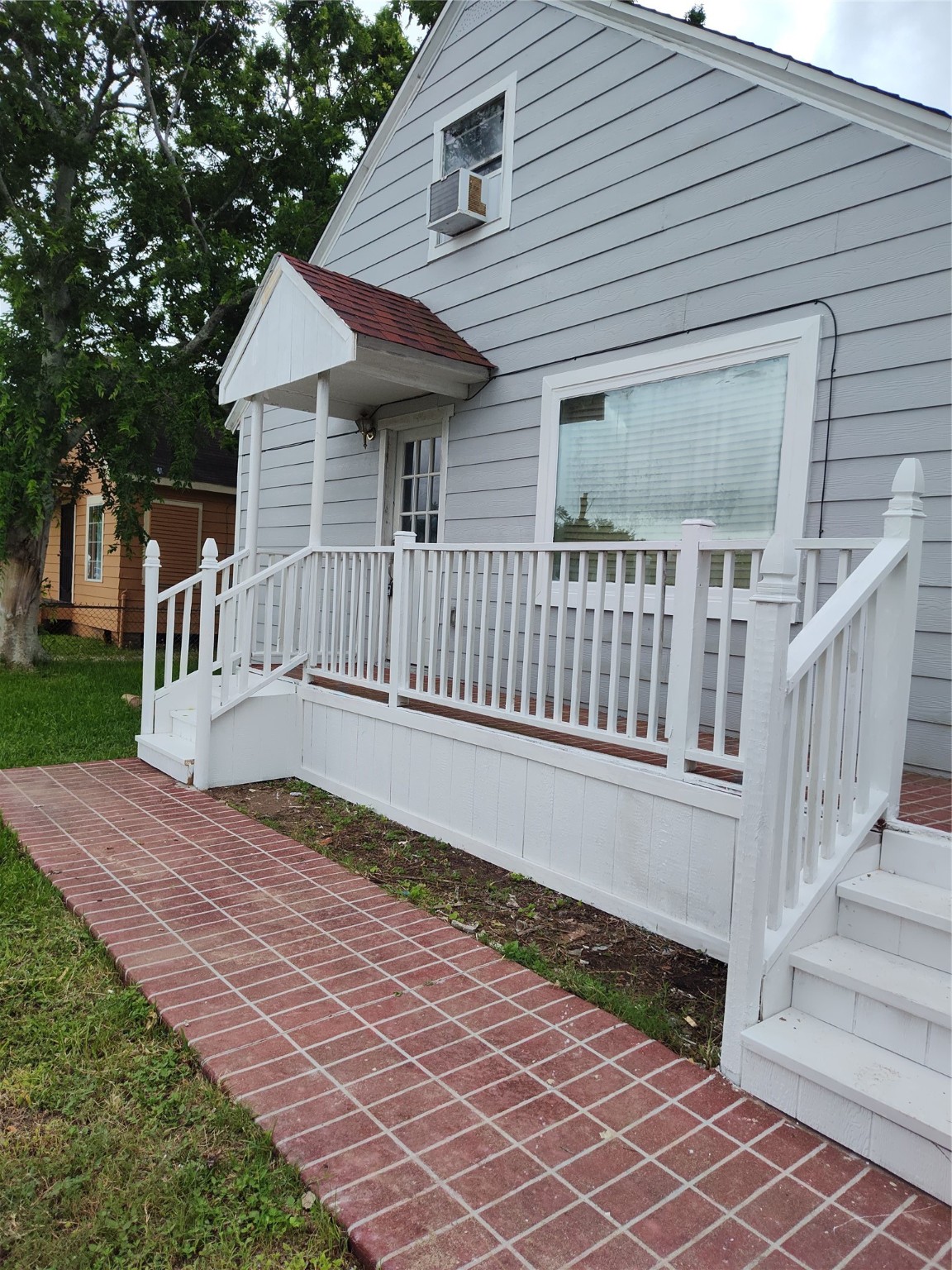 a view of backyard with a deck