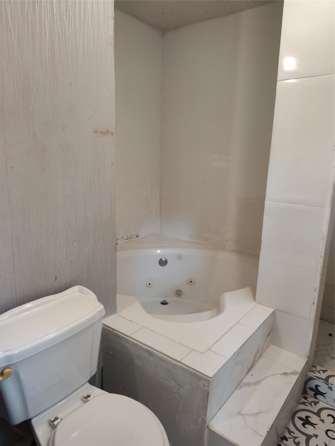 527 West 6th Street Freeport, TX 77541 - Photo 12 of 25 a white toilet sitting next to a shower