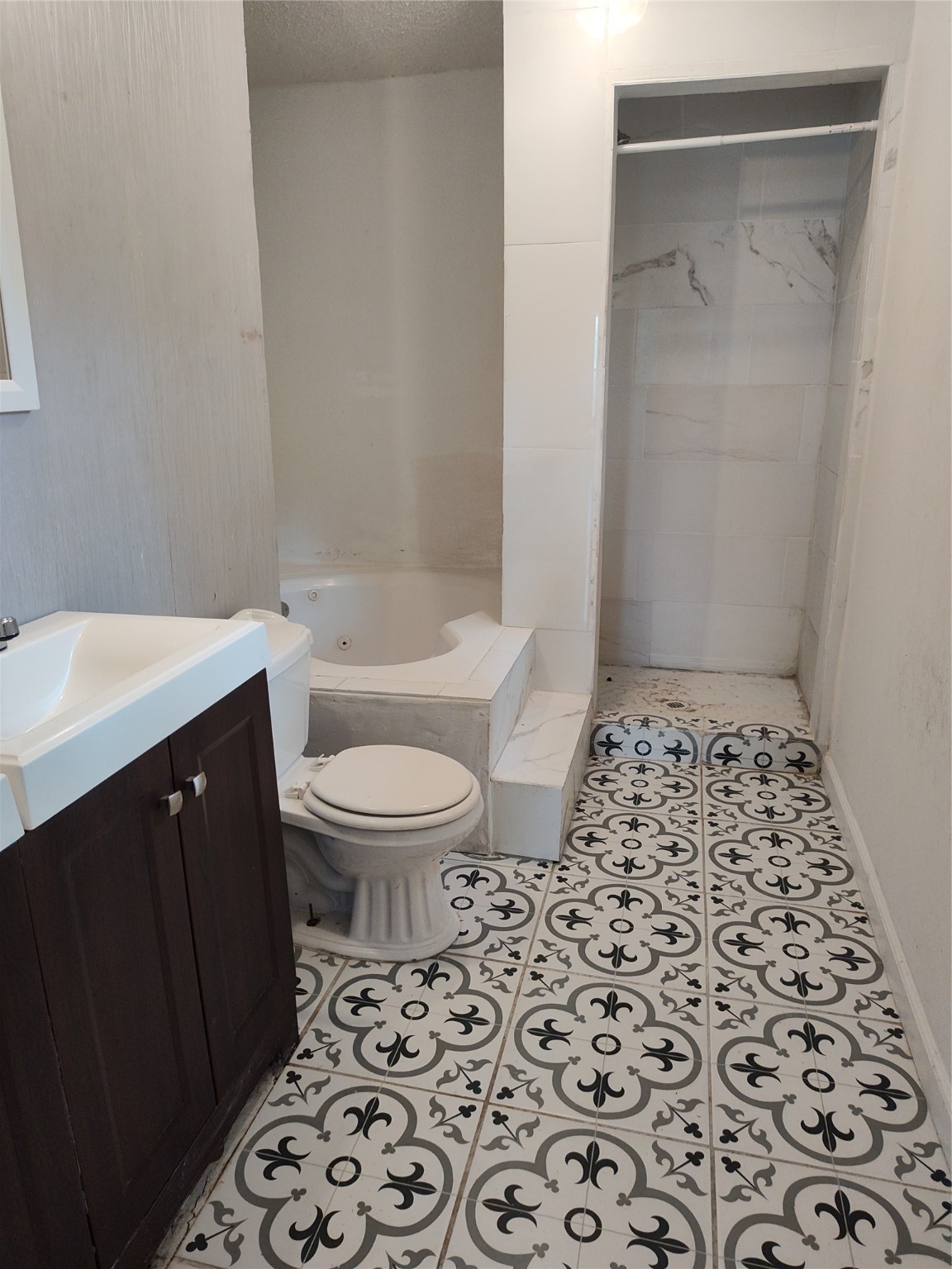 527 West 6th Street Freeport, TX 77541 - Photo 13 of 25 a bathroom with a sink toilet and shower