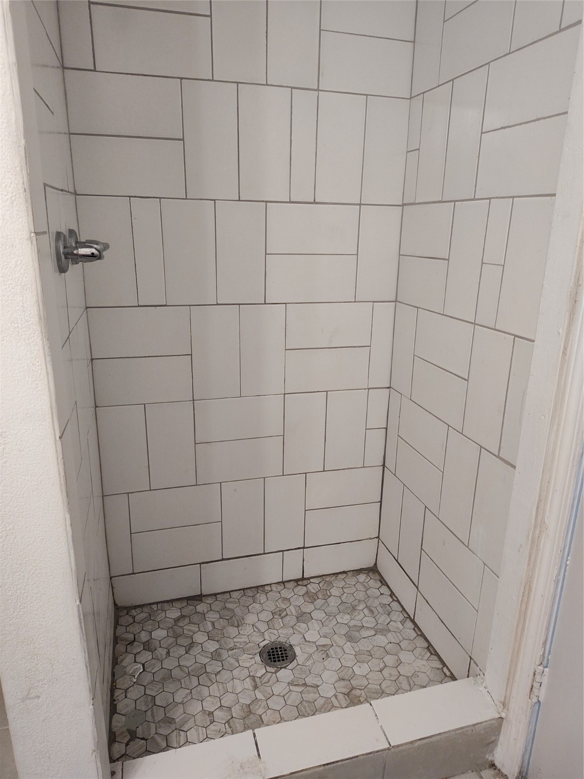 527 West 6th Street Freeport, TX 77541 - Photo 16 of 25 a bathroom with a shower
